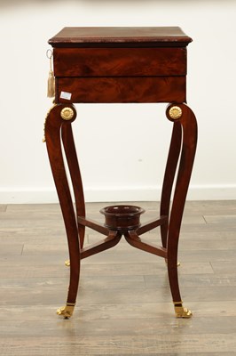 Lot 1687 - A 19TH CENTURY FRENCH EMPIRE FIGURED MAHOGANY AND ORMOLU MOUNTED WORK TABLE