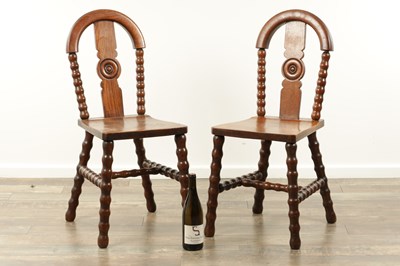 Lot 1590 - AN UNUSUAL PAIR OF ARTS AND CRAFTS OAK HALL CHAIRS