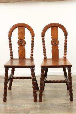 Lot 1590 - AN UNUSUAL PAIR OF ARTS AND CRAFTS OAK HALL CHAIRS
