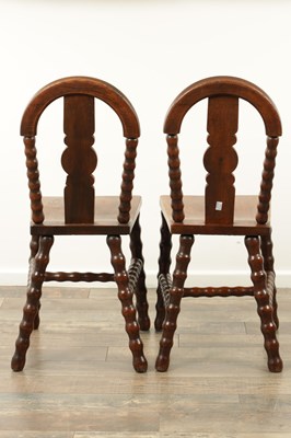 Lot 1590 - AN UNUSUAL PAIR OF ARTS AND CRAFTS OAK HALL CHAIRS