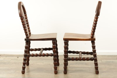 Lot 1590 - AN UNUSUAL PAIR OF ARTS AND CRAFTS OAK HALL CHAIRS