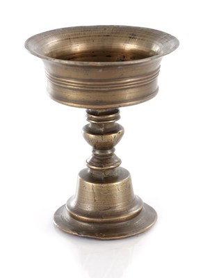 Lot 478 - AN EARLY TIBETAN CAST BRONZE BUTTER LAMP