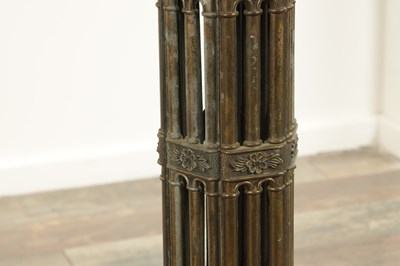 Lot 748 - A PAIR OF LATE 19TH CENTURY BRASS GOTHIC STYLE TORCHIERES