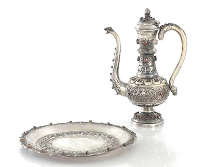Lot 390 - A LATE 19TH CENTURY INDO-PERSIAN SILVER EWER AND TRAY
