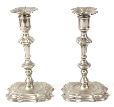 Lot 325 - A PAIR OF GEORGE II PAKTONG CANDLESTICKS with...