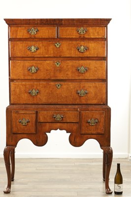 Lot 1690 - A QUEEN ANNE FIGURED WALNUT CHEST OF STAND