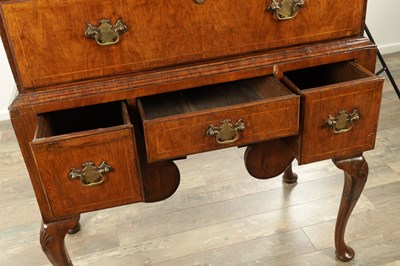 Lot 1690 - A QUEEN ANNE FIGURED WALNUT CHEST OF STAND
