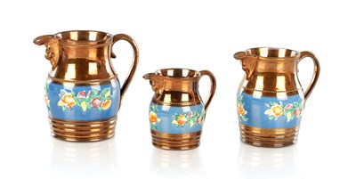 Lot 41 - A GRADUATED SET OF THREE 19TH CENTURY COPPER LUSTRE WARE MUGS
