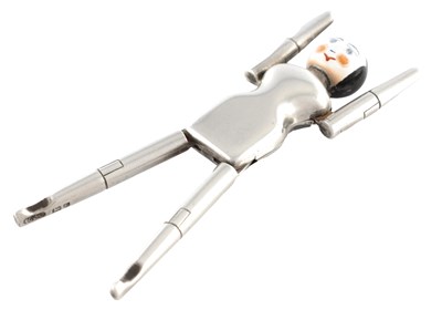 Lot 286 - A PAIR OF SILVER AND ENAMEL ‘DUTCH DOLL’ SUGAR TONGS