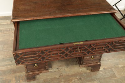 Lot 1627 - A GEORGE III MAHOGANY CHIPPENDALE STYLE KNEEHOLE DESK