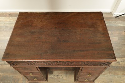 Lot 1627 - A GEORGE III MAHOGANY CHIPPENDALE STYLE KNEEHOLE DESK