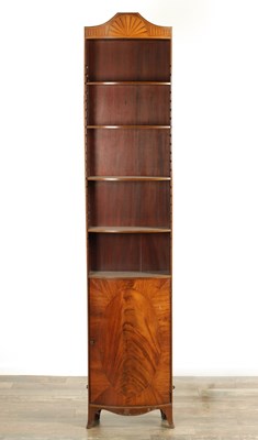 Lot 1596 - AN EARLY 20TH CENTURY FLAMED MAHOGANY BOW-FRONTED SHERATON STYLE OPEN BOOKCASE