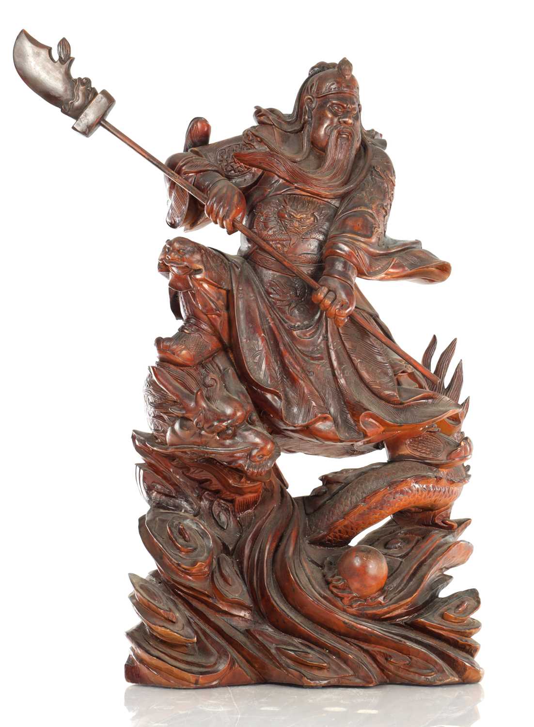Lot 132 - A LATE 19TH CENTURY CARVED HARDWOOD FIGURE OF A WARRIOR STANDING ON A DRAGON