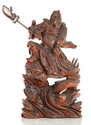 Lot 504 - A LATE 19TH CENTURY CARVED HARDWOOD FIGURE OF A WARRIOR STANDING ON A DRAGON