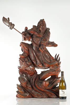 Lot 132 - A LATE 19TH CENTURY CARVED HARDWOOD FIGURE OF A WARRIOR STANDING ON A DRAGON