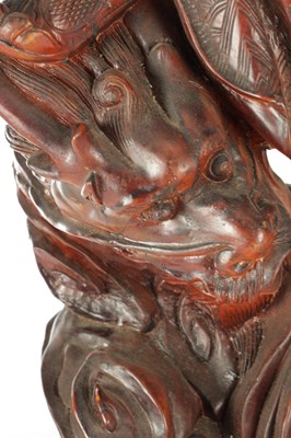 Lot 132 - A LATE 19TH CENTURY CARVED HARDWOOD FIGURE OF A WARRIOR STANDING ON A DRAGON