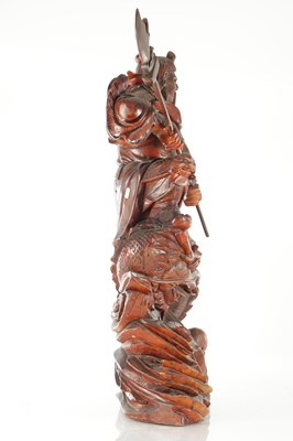 Lot 132 - A LATE 19TH CENTURY CARVED HARDWOOD FIGURE OF A WARRIOR STANDING ON A DRAGON
