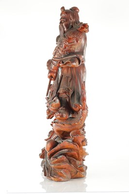 Lot 132 - A LATE 19TH CENTURY CARVED HARDWOOD FIGURE OF A WARRIOR STANDING ON A DRAGON