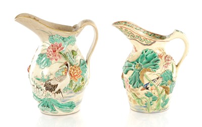 Lot 511 - TWO JAPANESE MEIJI PERIOD RELIEF MOULDED CERAMIC JUGS