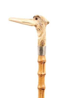 Lot 1061 - A 19TH CENTURY CARVED HORN GROTESQUE WALKING STICK