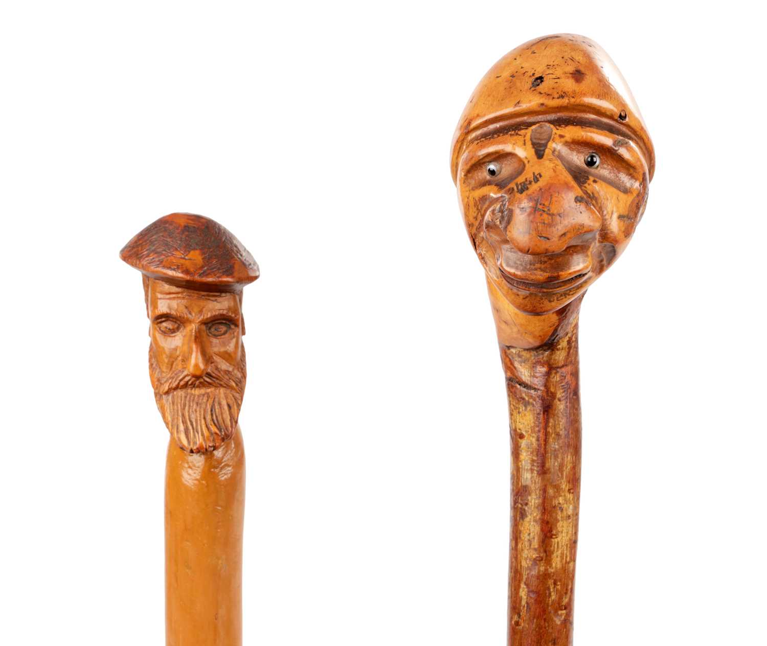 Lot 118 - TWO LATE 19TH CENTURY FOLK ART CARVED HEAD WALKING STICKS