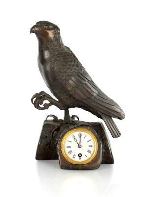Lot 573 - A JAPANESE MEIJI PERIOD DESK CLOCK FORMED AS A SEATED EAGLE ON BRANCH WORK