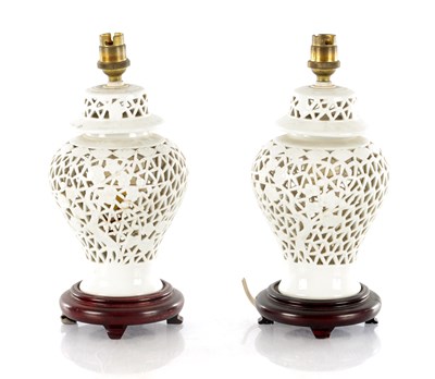 Lot 607 - A PAIR OF BLANC DE CHINE PEICERED PORCELAIN VASES