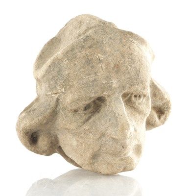 Lot 914 - AN EARLY MEDIEVAL STYLE CARVED STONE HEAD