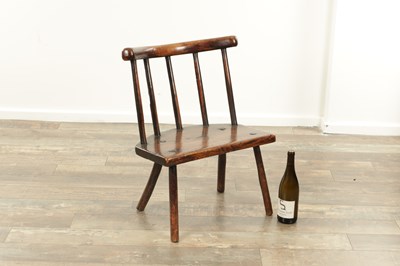 Lot 1660 - AN 18TH CENTURY WELSH PRIMITIVE ASH AND ELM STICK BACK CHAIR