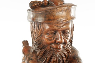 Lot 961 - A LATE 19TH CENTURY BLACK FOREST COBBLER TOBACCO JAR AND MATCH HOLDER OF LARGE SIZE