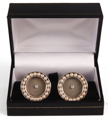 Lot 157 - A good pair of 14ct white gold CUFFLINKS inset...