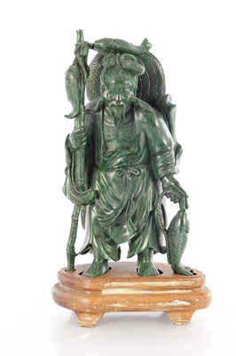 Lot 362 - A 19TH CENTURY CHINESE SPINACH GREEN JADE CARVING OF A FISHERMAN