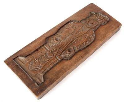 Lot 364 - A 19TH CENTURY CARVED WALNUT GINGERBREAD MOULD...