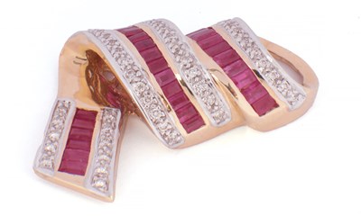 Lot 148 - A 14CT GOLD RUBY AND DIAMOND SET DROP RIBBON PENDANT