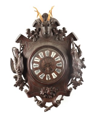 Lot 1340 - A 19TH CENTURY BLACK FOREST CARVED OAK HANGING WALL CLOCK