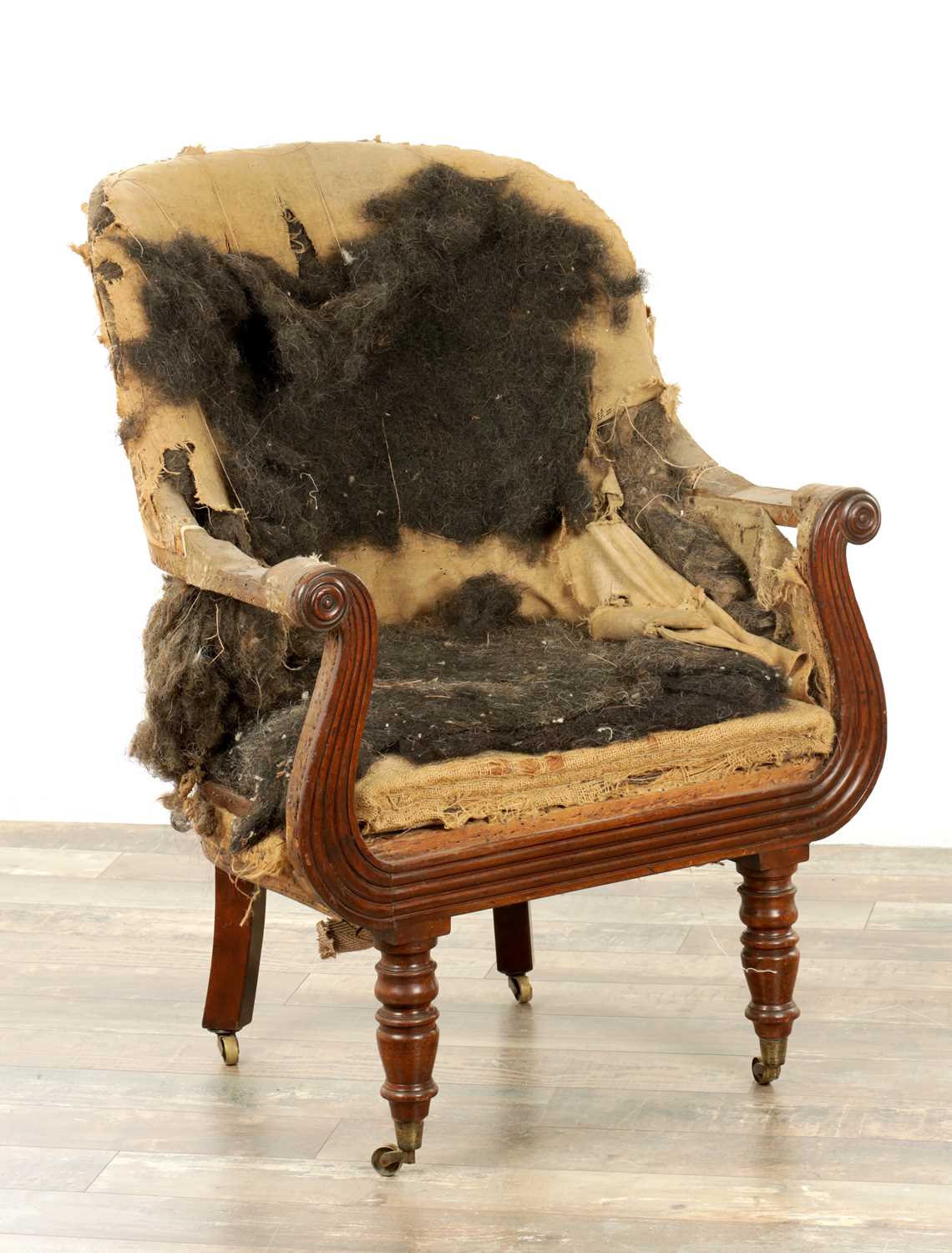 Lot 1586 - A GOOD REGENCY MAHOGANY SHAPED LIBRARY CHAIR