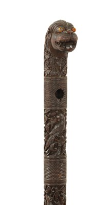 Lot 1085 - A 19TH CENTURY SOUTH INDIAN MYSORE CARVED SANDALWOOD WALKING STICK