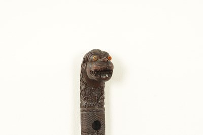 Lot 1085 - A 19TH CENTURY SOUTH INDIAN MYSORE CARVED SANDALWOOD WALKING STICK