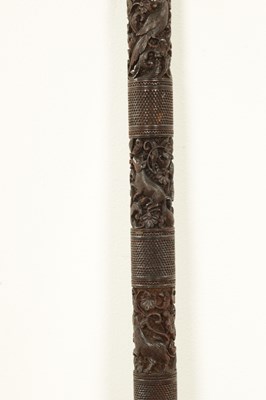 Lot 1085 - A 19TH CENTURY SOUTH INDIAN MYSORE CARVED SANDALWOOD WALKING STICK