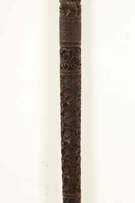 Lot 1085 - A 19TH CENTURY SOUTH INDIAN MYSORE CARVED SANDALWOOD WALKING STICK