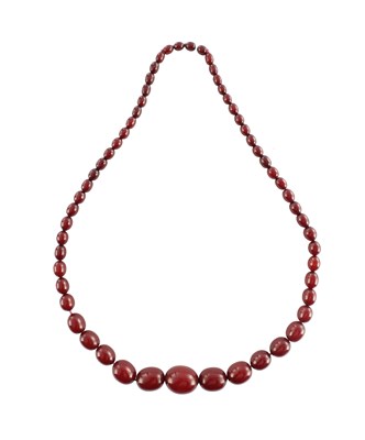 Lot 172 - A GRADUATED CHERRY AMBER OVAL BEAD NECKLACE