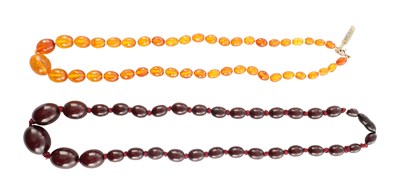 Lot 169 - A GRADUATED CHERRY AMBER OVAL BEAD NECKLACE
