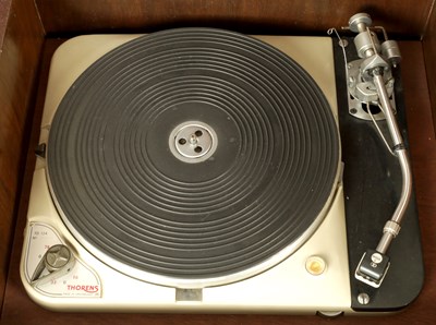 Lot 1020 - A THORENS TD 124 TURNTABLE WALNUT MUSIC CABINET