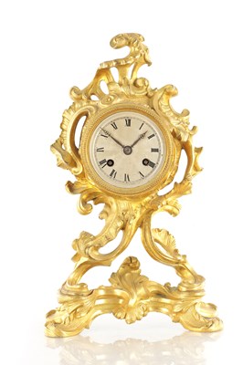 Lot 1323 - A 19TH CENTURY FRENCH ORMOLU ROCOCO MANTEL CLOCK