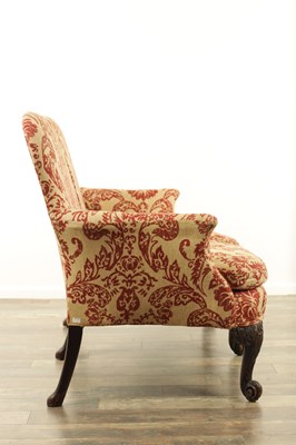 Lot 1315 - A GEORGE II STYLE TWO SEATER CARVED MAHOGANY SETTEE
