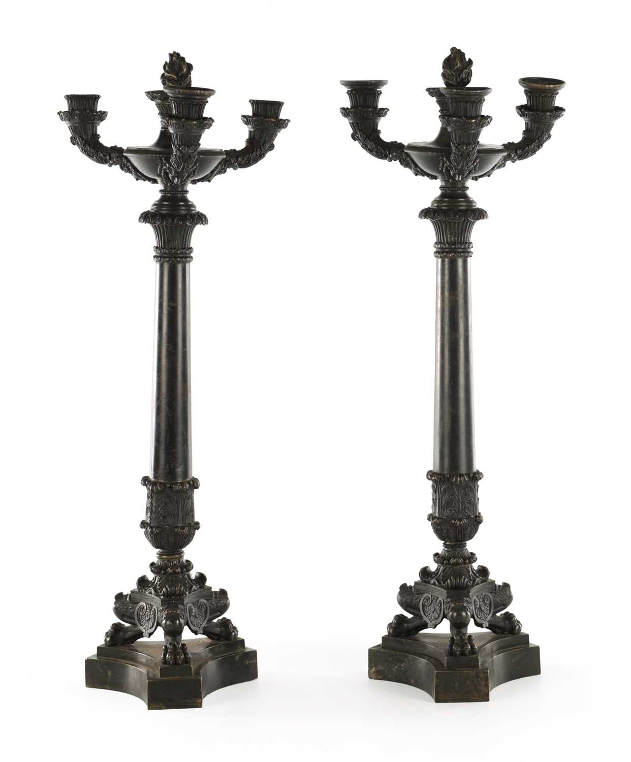 Lot 520 - A PAIR OF REGENCY BRONZE THREE BRANCH CANDELABRA