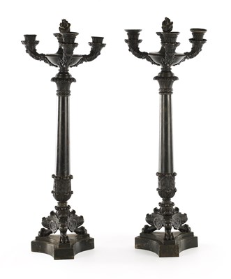 Lot A PAIR OF REGENCY BRONZE THREE BRANCH CANDELABRA