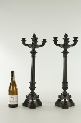 Lot 520 - A PAIR OF REGENCY BRONZE THREE BRANCH CANDELABRA