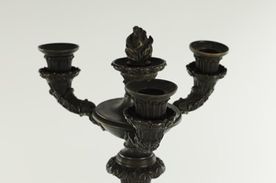 Lot 520 - A PAIR OF REGENCY BRONZE THREE BRANCH CANDELABRA
