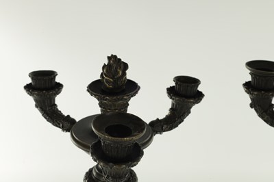 Lot 520 - A PAIR OF REGENCY BRONZE THREE BRANCH CANDELABRA